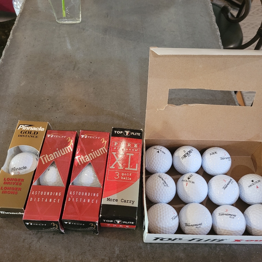 Golf balls assortment of 23 never used. In original packages